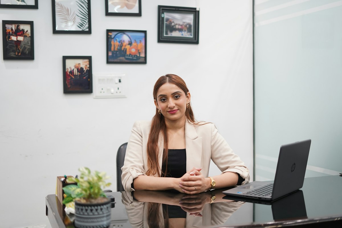 A founder reviewing her business plan at her desk